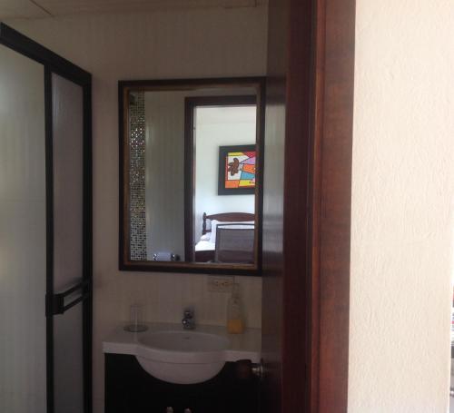a bathroom with a sink and a mirror at Aire Libre Descanso in San Francisco