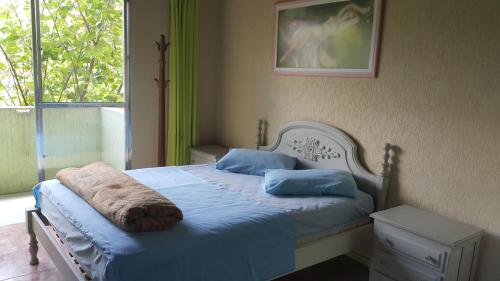 Ліжко або ліжка в номері Residencial Mogi das Cruzes