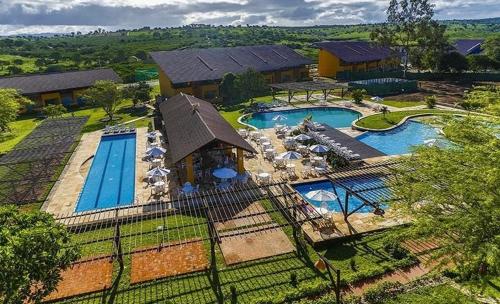 an aerial view of a resort with two swimming pools at Winterville Flats Gravatá in Gravatá