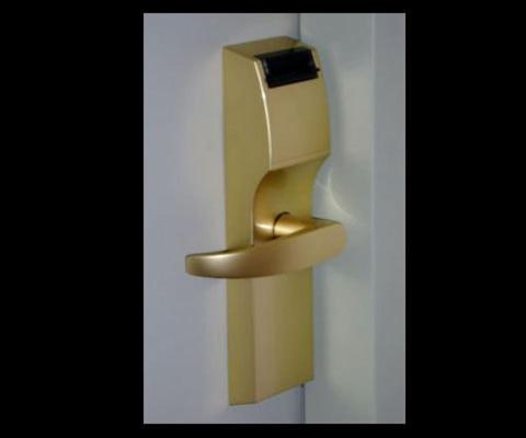 a brass toilet paper dispenser on a white wall at Hotel Juramento in Buenos Aires