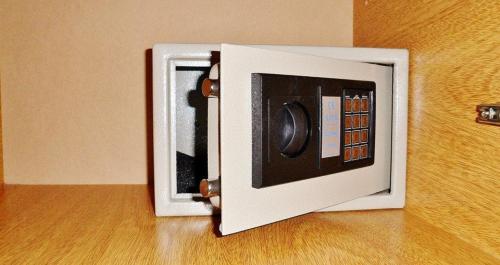 a white microwave oven sitting on top of a wooden floor at Hotel Juramento in Buenos Aires