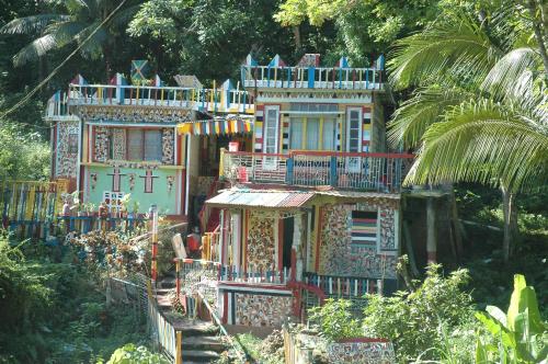 a colorful house with a lot of decorations on it at Moon San Villa at the Blue Lagoon in Port Antonio