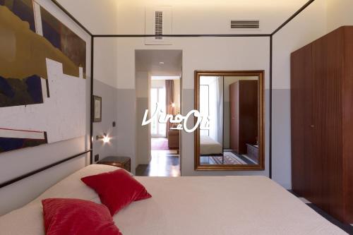 מיטה או מיטות בחדר ב-Vino e Oli Residenze