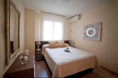 a bedroom with a large bed and a window at Tendency Sagrada Familia Deluxe in Barcelona