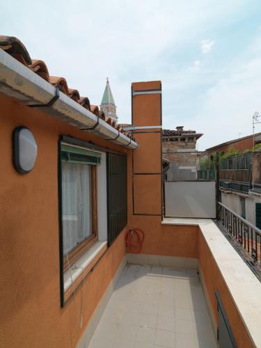 a balcony of a building with a window at Casa Fantasy in Venice
