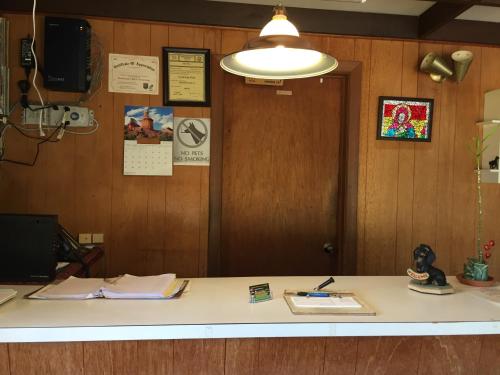 an office with a desk with a light on it at North King Motel in Northampton