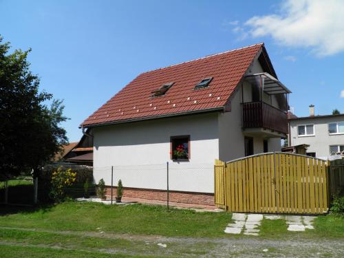 a white house with a red roof at Privat Kovacova in Žiar