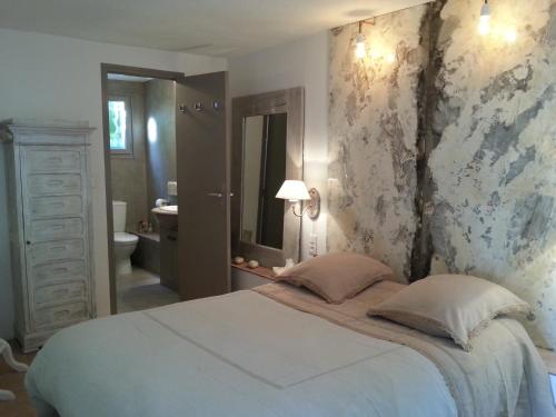 Ένα ή περισσότερα κρεβάτια σε δωμάτιο στο Chambre d'hotes Casa Biba