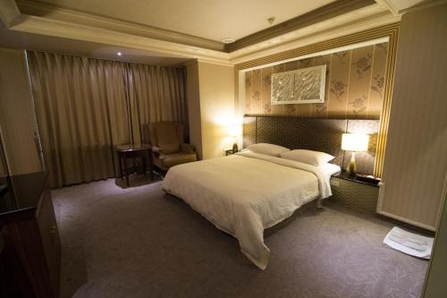 Кровать или кровати в номере Mila Hotel