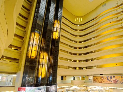 a lobby of a hotel with a large building at Grand Hotel Hamamatsu in Hamamatsu