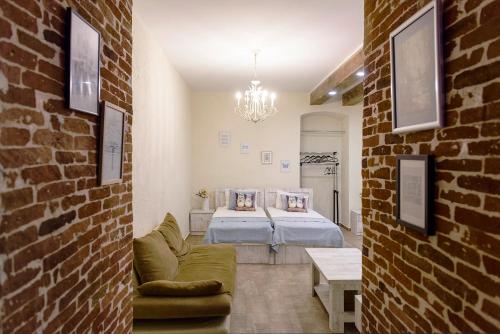a bedroom with a bed and a couch in a room at New&Old in Tbilisi City