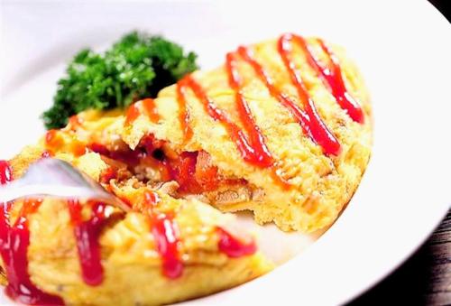 a white plate with a piece of food and broccoli at Swissotel Foshan, Guangdong - Free shuttle to Canton Fair in Foshan