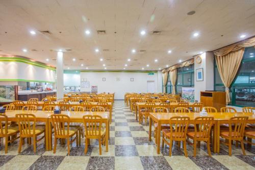 an empty restaurant with tables and chairs in it at Ilsung Condo Namhan River in Yeoju