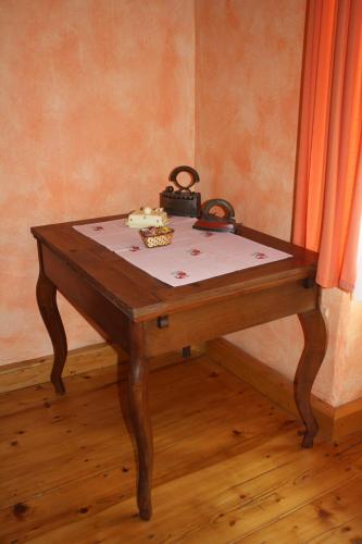 a table with a cake on top of it at Ubytovanie u Janusa in Levoča