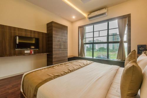 Ένα ή περισσότερα κρεβάτια σε δωμάτιο στο Hotel BKC Inn - Near Trade Center, Visa Consulate BKC