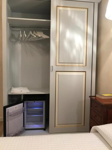 a door leading into a bedroom with a desk at Hotel "La Salute" in Monte Grimano Terme