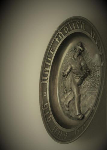 a silver coin with a man on it at Frăgăria in Zimandcuz