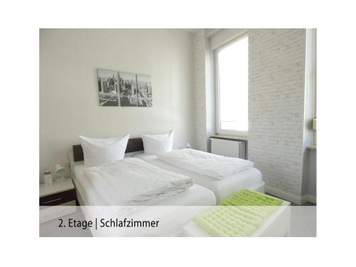 Säng eller sängar i ett rum på Ferienwohnung Trier Stadtmitte/Fußgängerzone