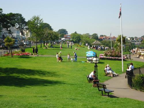 a group of people sitting in a park at The Buccaneer Inn in Torquay