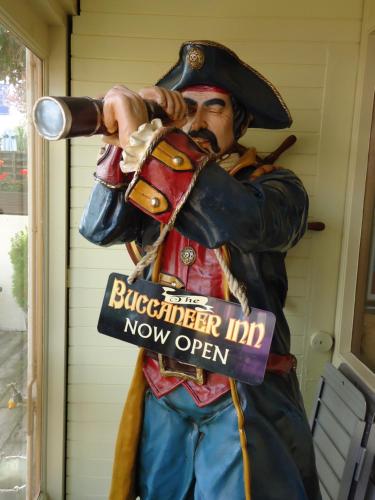 a statue of a man in uniform holding a gun at The Buccaneer Inn in Torquay