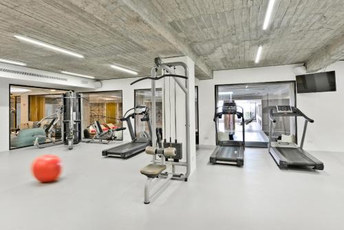 a gym with several tread machines and a ball at Napa Mermaid Hotel & Suites in Ayia Napa
