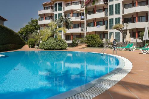 a swimming pool in front of a apartment building at Apartment Bay Historic Center in Funchal