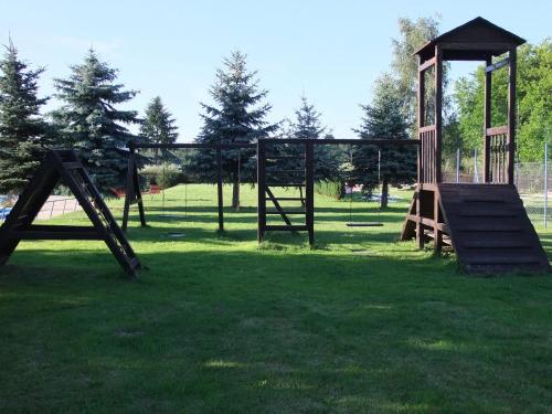 an empty playground with a swing set in a park at Hotel Formule in Děčín