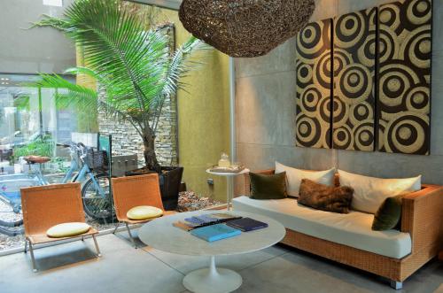 a living room with a couch and a table at Mine Hotel in Buenos Aires