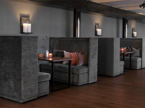 a living room with a couch and a table at Soria Moria Hotell in Oslo