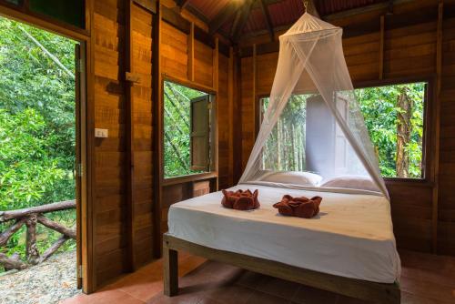 Letto o letti in una camera di Art's Riverview Lodge