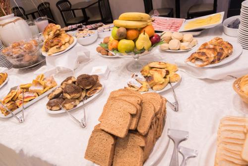 a table with many plates of food on it at Gran Hotel Continental in Mar del Plata