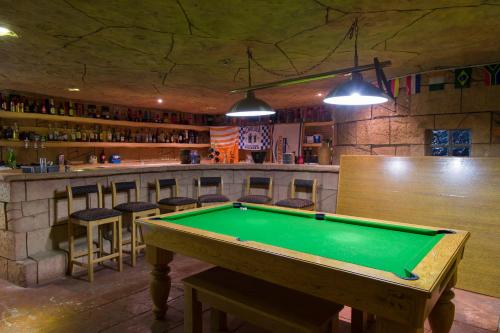 a pool table in a room with a bar at Bayswater Lodge in Bloemfontein