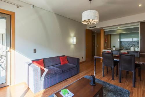 a living room with a couch and a table at Onice Apartment in Porto