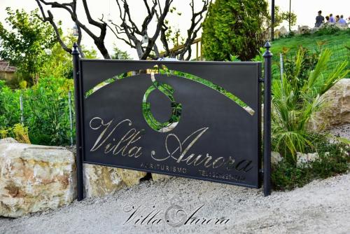a sign for the villa algarve resort at Villa Aurora in Villanova del Battista