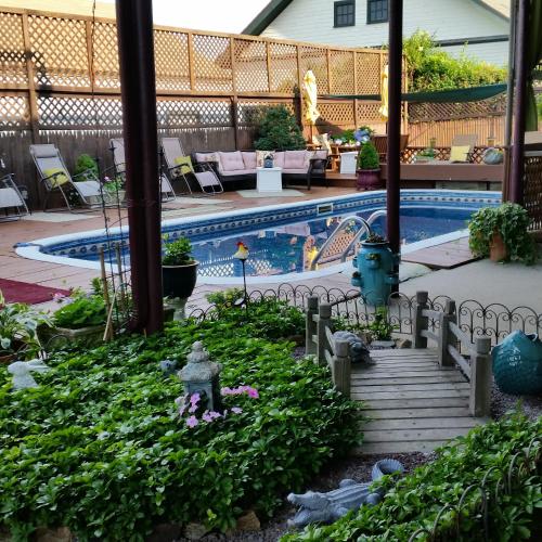 a miniature garden with a swimming pool in a house at Murray House in Newport