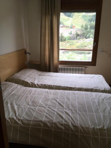 Una cama o camas en una habitación de Sol Tarter