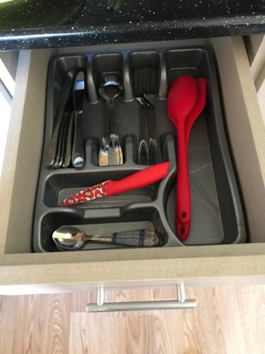 a drawer filled with utensils in a drawer at Room 46 in Gudauri