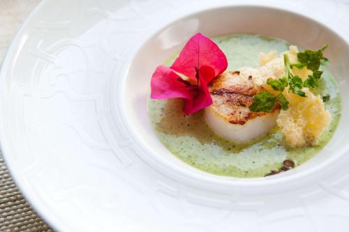 a bowl of soup with a piece of food in it at Hacienda San Jose Cholul in Tixkokob