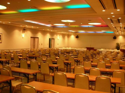 an empty lecture hall with tables and chairs at Renaissance Tanagura in Shirakawa