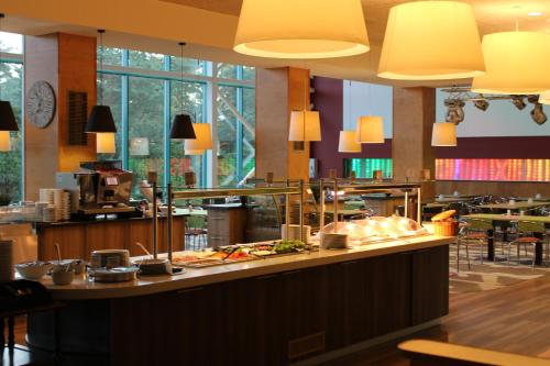 a restaurant with a counter with food on it at Toila Spa Hotel in Toila