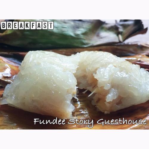 a close up of a piece of rice on a plate at Fundee Story Guesthouse Bamboo House in Chiang mai old town in Chiang Mai