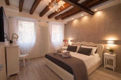 En eller flere senge i et værelse på Ca del Pape