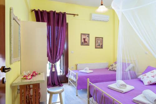 A bed or beds in a room at Nikola's Villa Stalos Chania