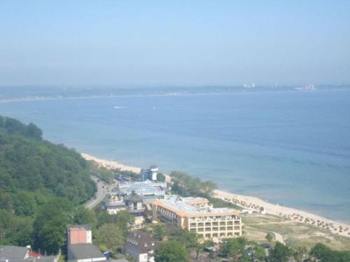 a view of a beach with a hotel and the ocean at PREMIUM APARTMENT 615 in Timmendorfer Strand