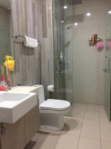 a bathroom with a shower and a toilet and a sink at Great Value Family Apartment to Family Apartment @ M-City in Kuala Lumpur