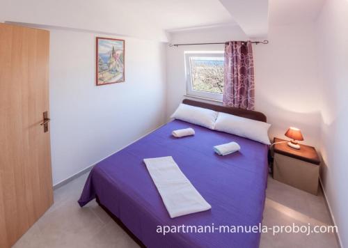 Postel nebo postele na pokoji v ubytování Manuela Apartmani Proboj