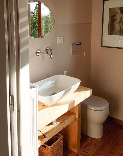 a bathroom with a sink and a toilet at B&B Villa Tavallini in Pollone