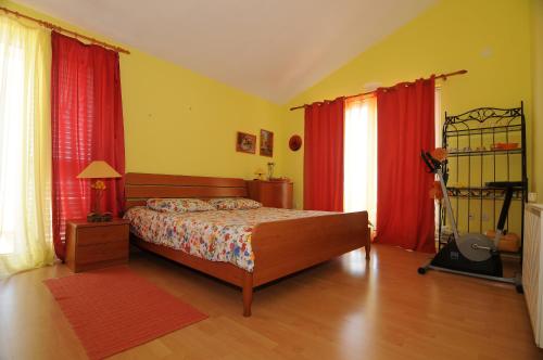 Postel nebo postele na pokoji v ubytování Villa Dario