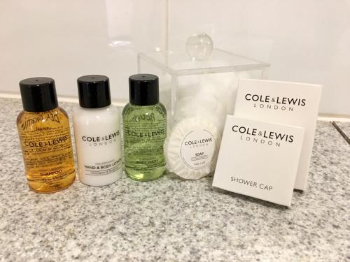 three bottles of hair products sitting on a counter at Padbrook Park Hotel in Cullompton