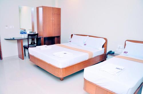 Katil atau katil-katil dalam bilik di Hotel Raams Park